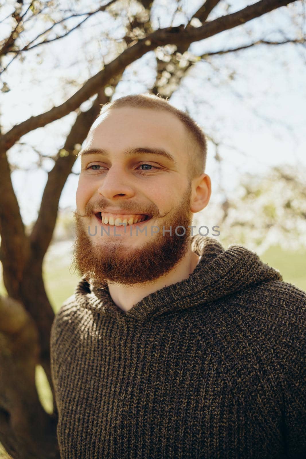 happy young man outdoors looking at the camera