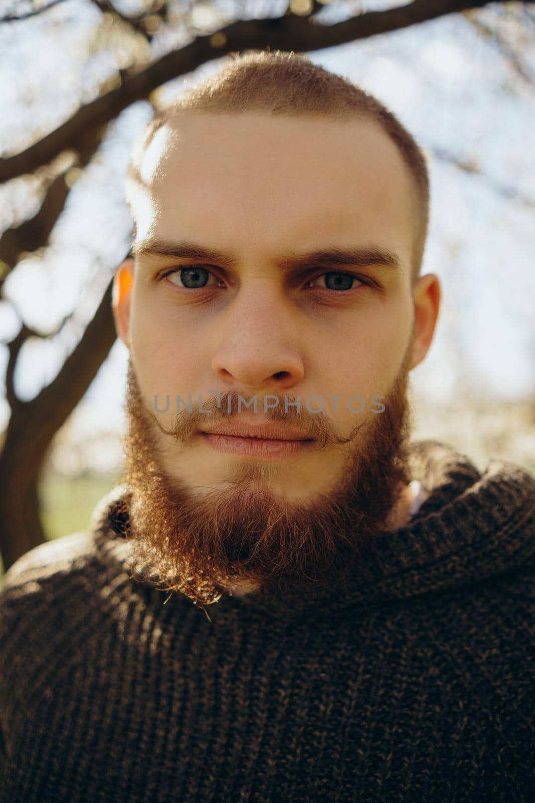 happy young man outdoors looking at the camera