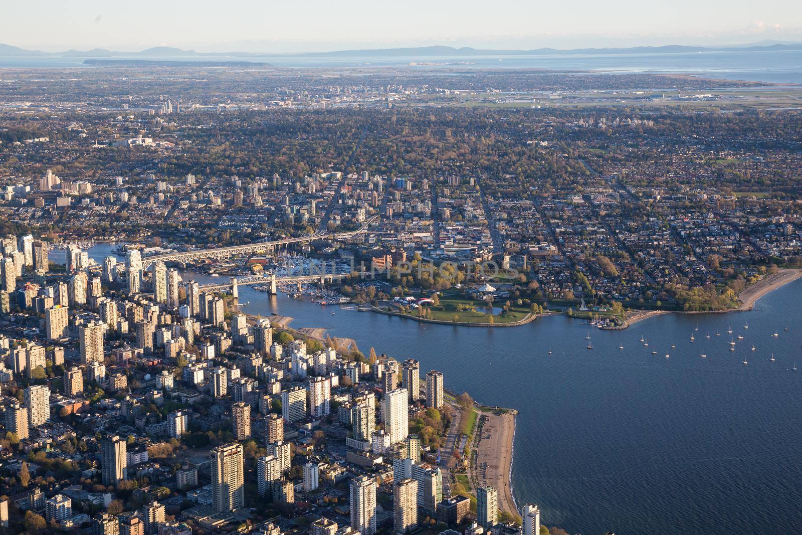 Aerial View of Vancouver Downtown, British Columbia, Canada, during a bright spring sunset.
