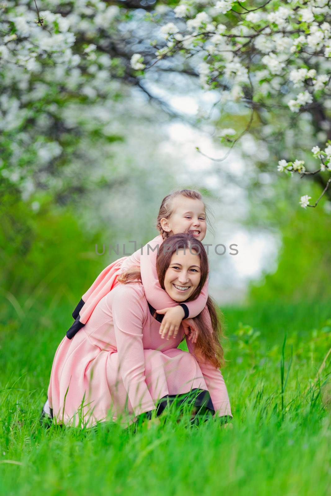 mother and daughter hugging by zokov