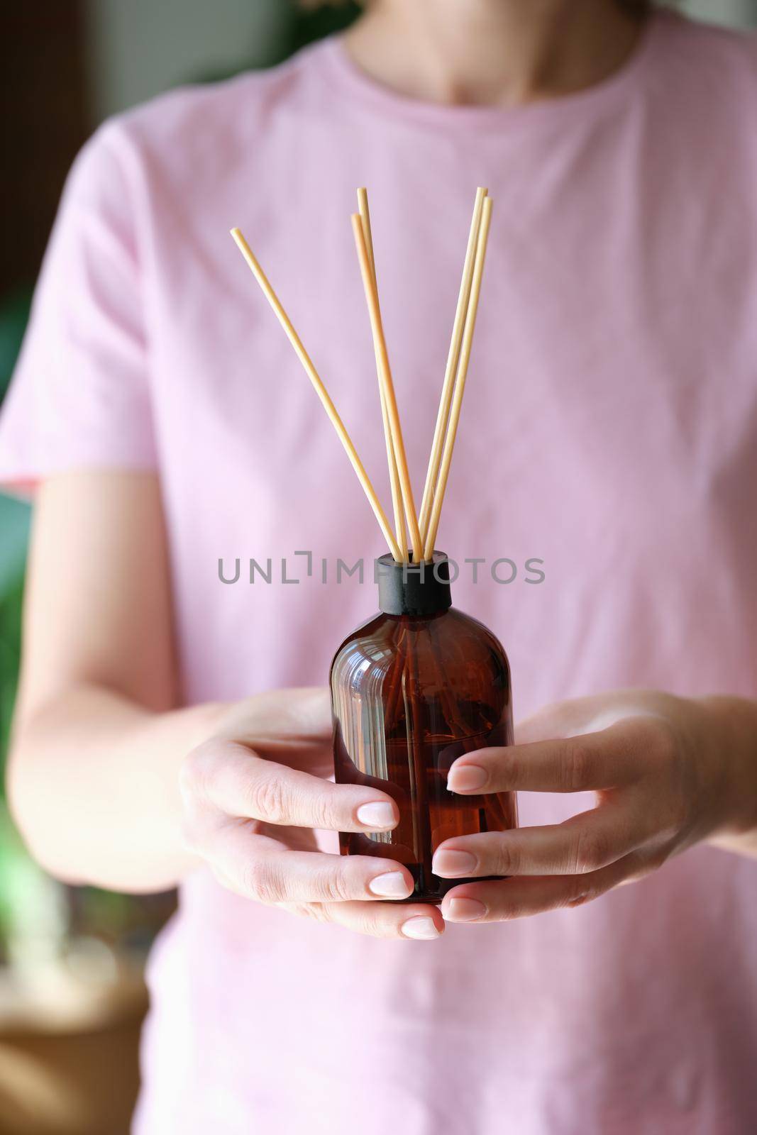 Aroma reed diffuser, home fragrance bottle with rattan sticks and smell of freshness by kuprevich