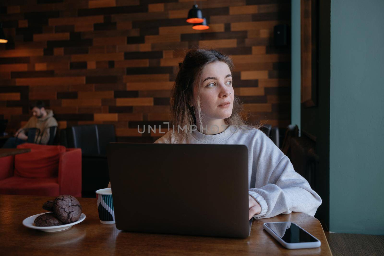 freelance woman happy working in a cafe remotely brunette