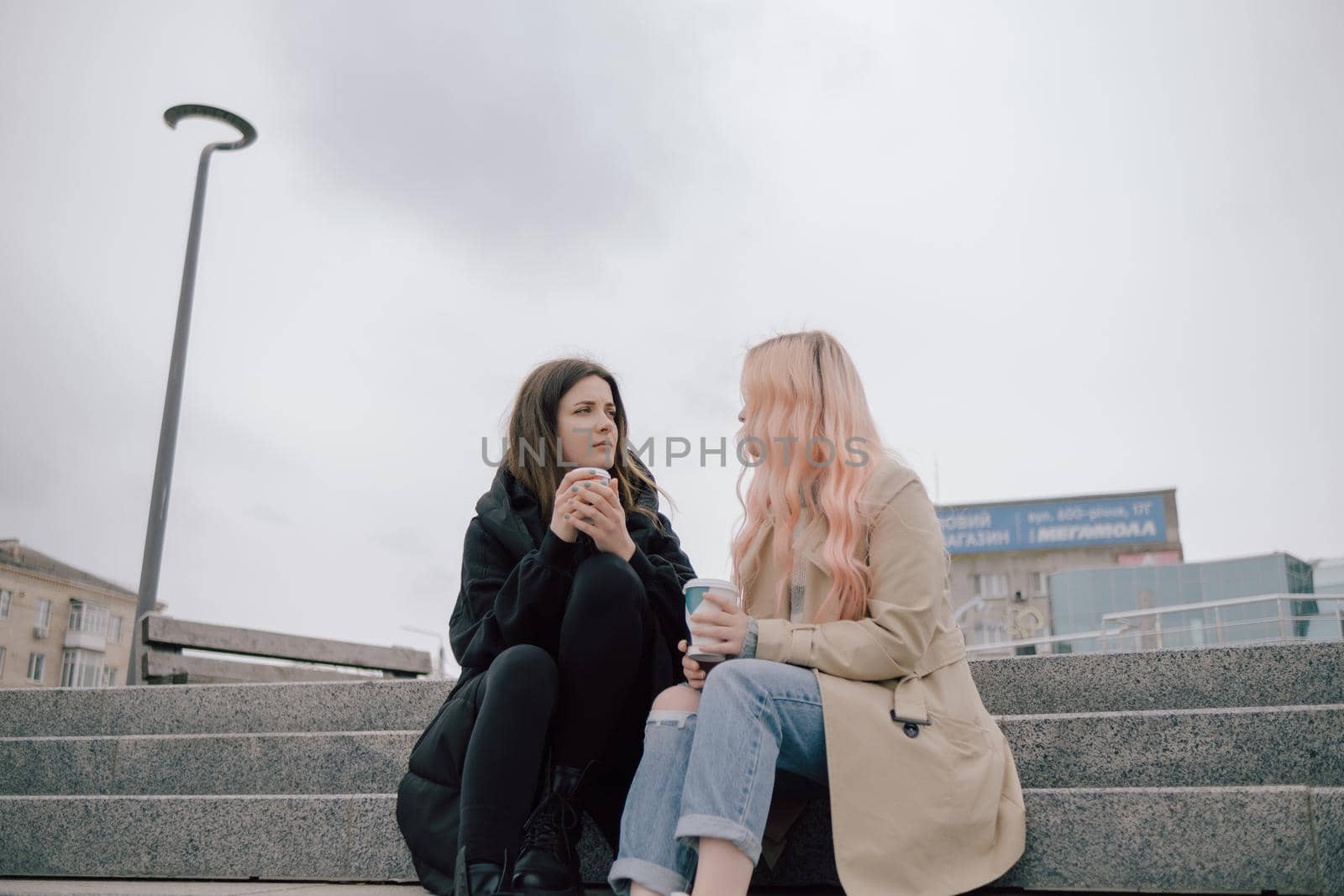 two woman conversation at the street smiling