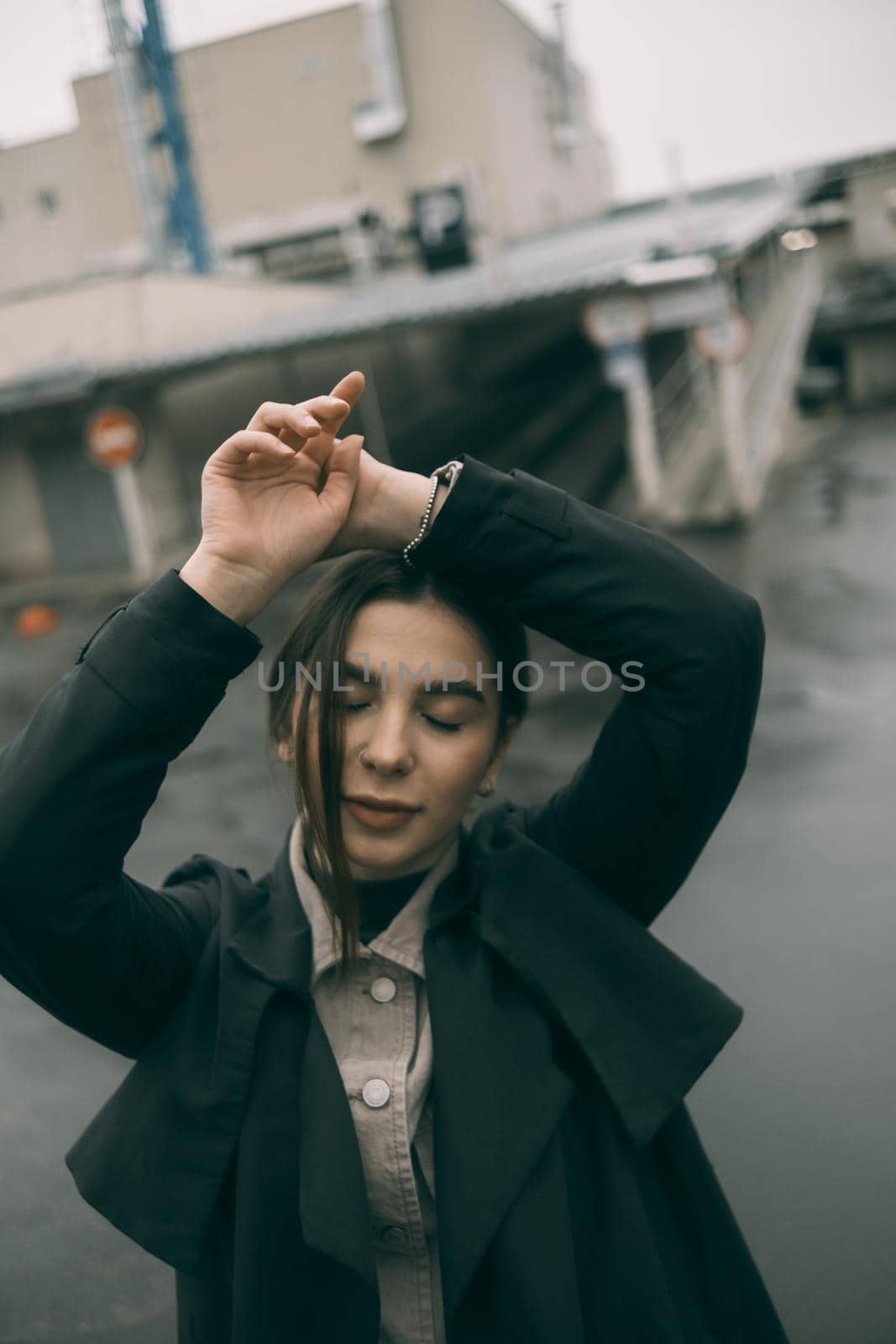 sensual portrait of brunette woman on street