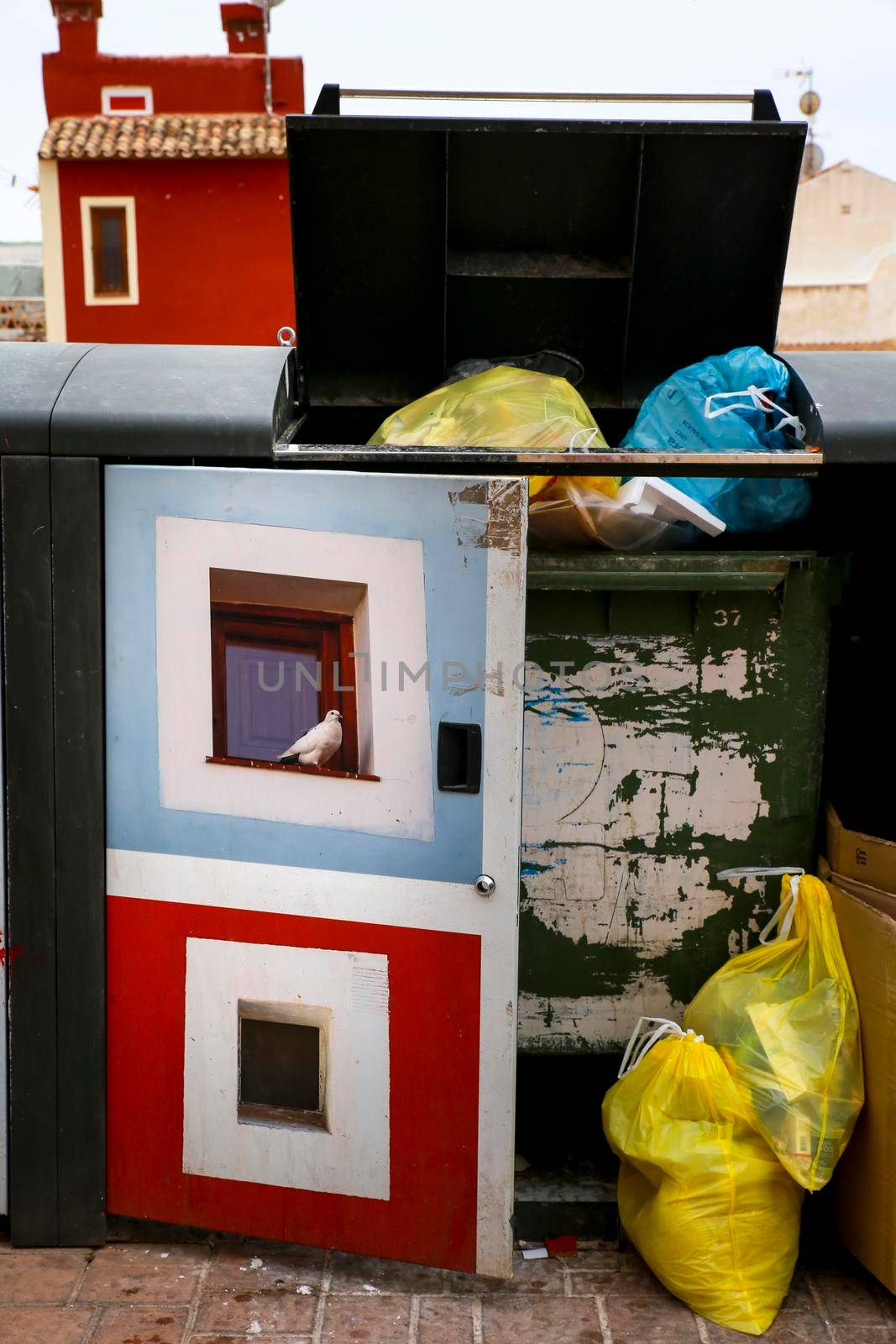 Garbage container with beautiful paintings on the street by soniabonet