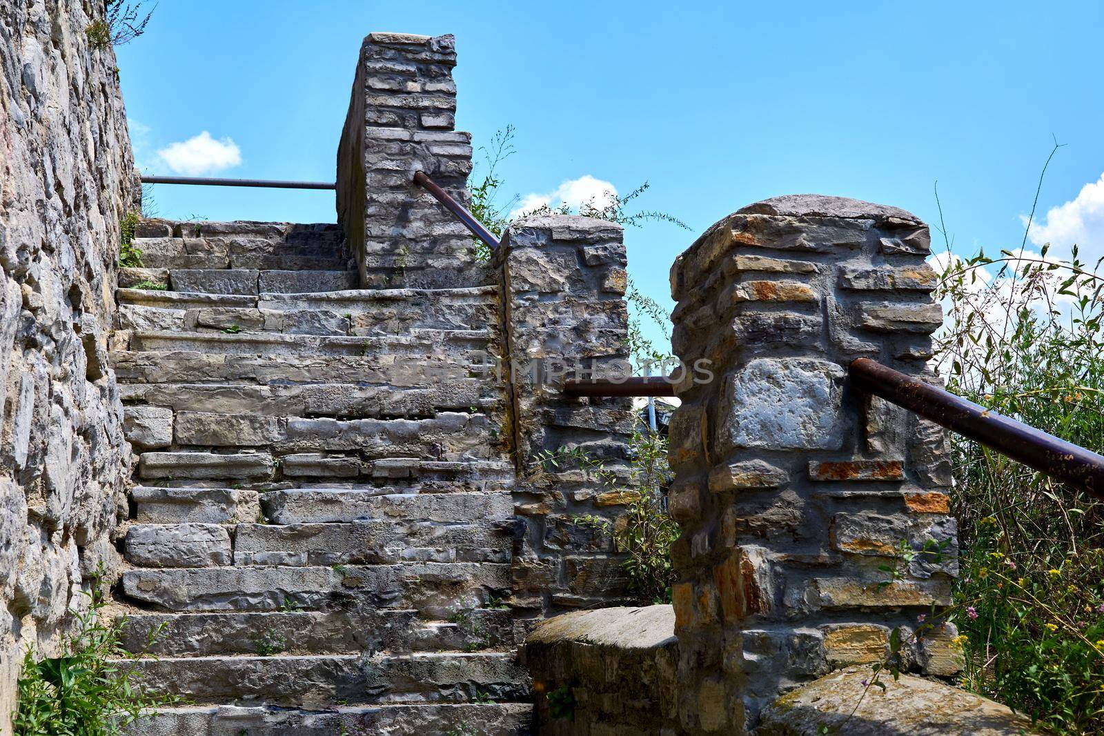 Old stone staircase with railing on the background of the sky by jovani68