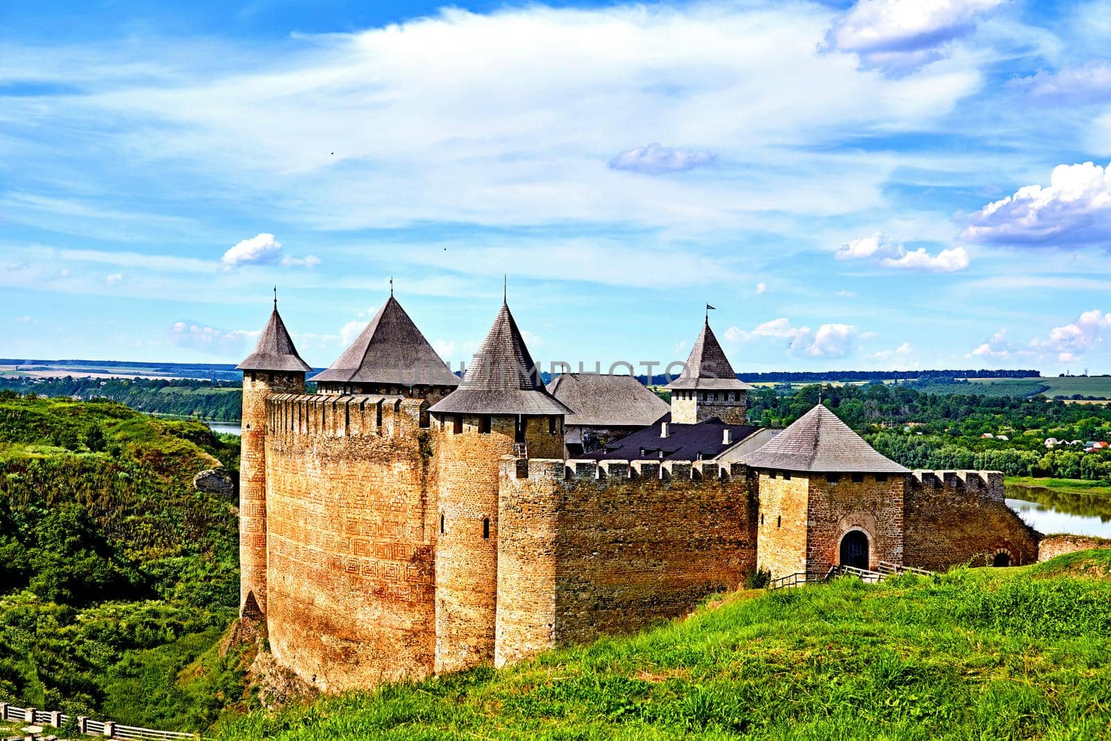 An old fortress on the green hills by the river by jovani68