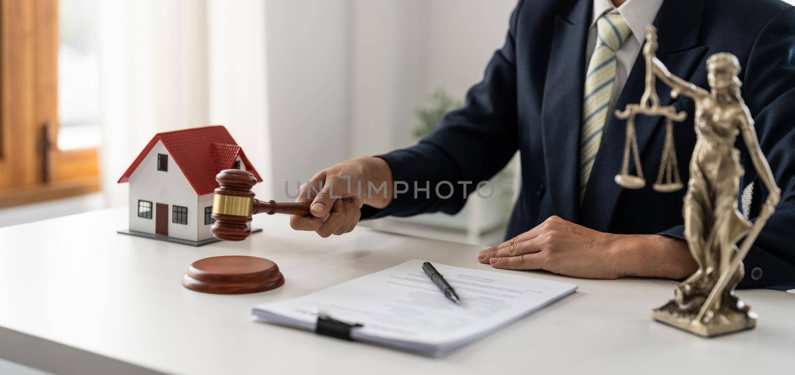 lawyers or notaries with gavel judge for the insurance compensations. concept of law and lawyer, judiciary and legislature applied to the democratic law.