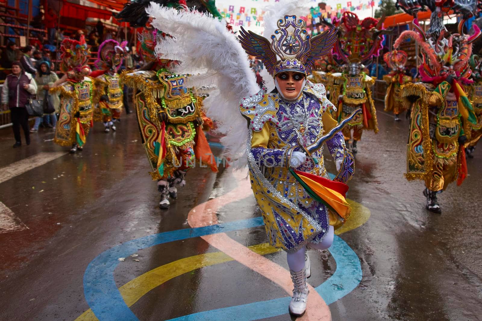 ORURO, BOLIVIA - FEBRUARY 25, 2017: Diablada dancers in ornate costumes parade through the mining city of Oruro on the Altiplano of Bolivia during the annual carnival.