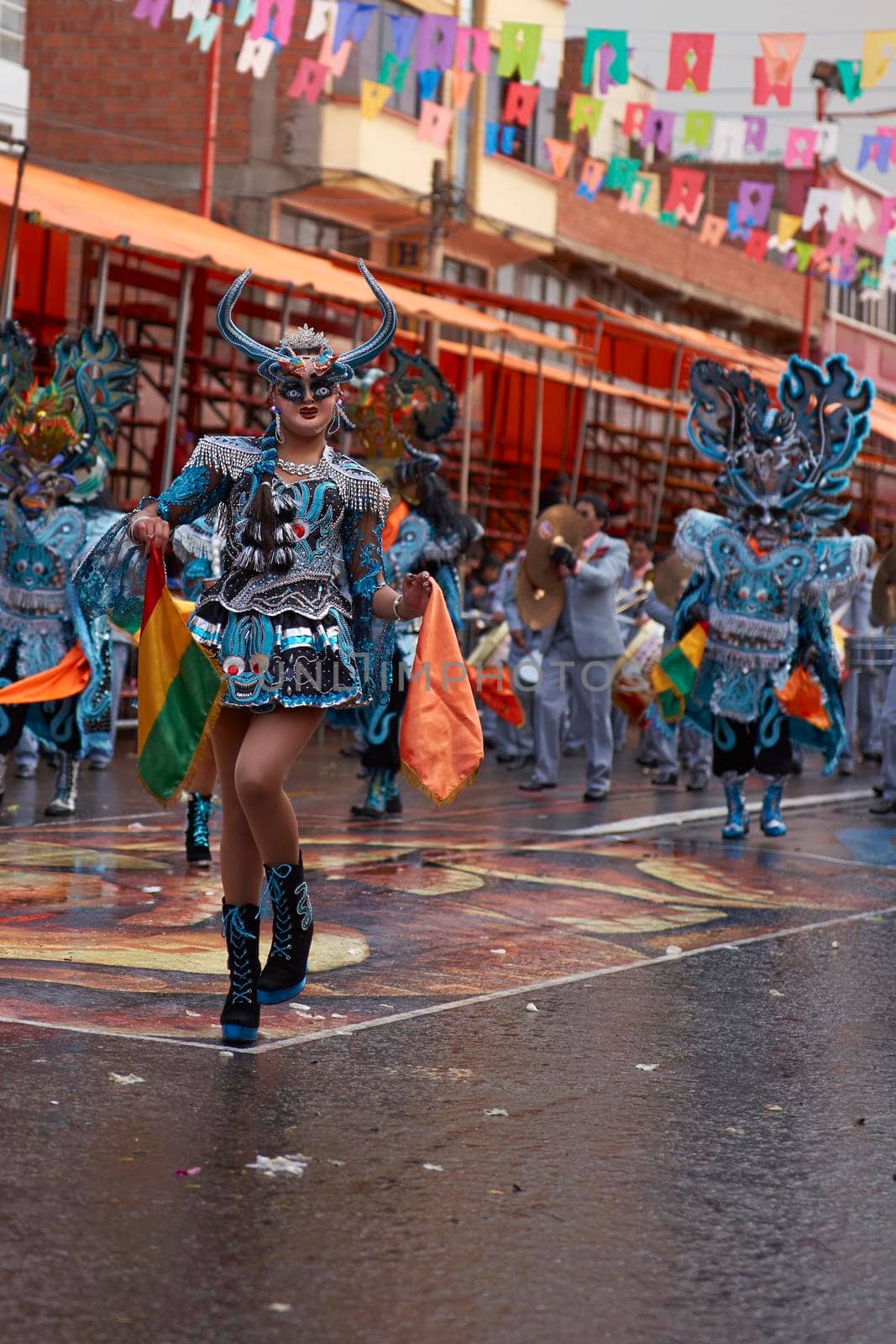 ORURO, BOLIVIA - FEBRUARY 25, 2017: Diablada dancers in ornate costumes parade through the mining city of Oruro on the Altiplano of Bolivia during the annual carnival.