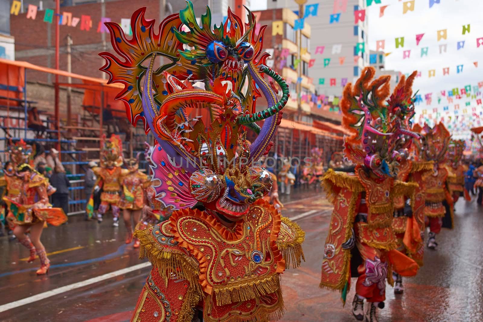 ORURO, BOLIVIA - FEBRUARY 25, 2017: Diablada dancers in ornate costumes parade through the mining city of Oruro on the Altiplano of Bolivia during the annual carnival.