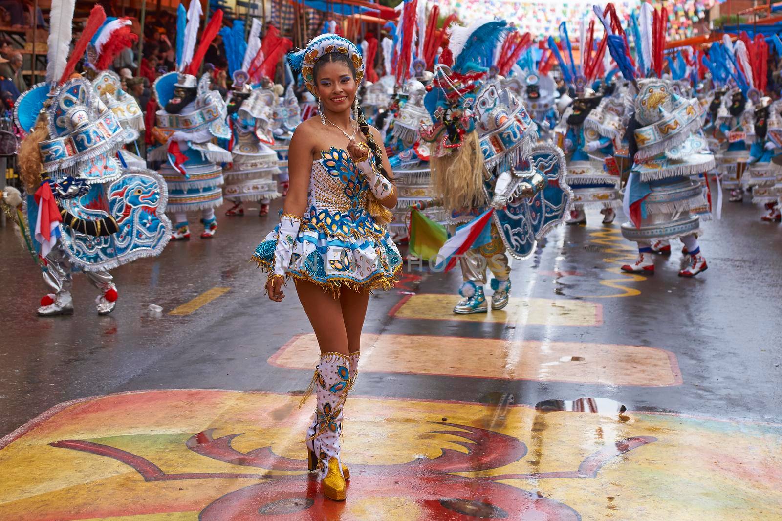 ORURO, BOLIVIA - FEBRUARY 25, 2017: Female Morenada dancers in colourful costumes parading through the mining city of Oruro on the Altiplano of Bolivia during the annual Oruro Carnival.