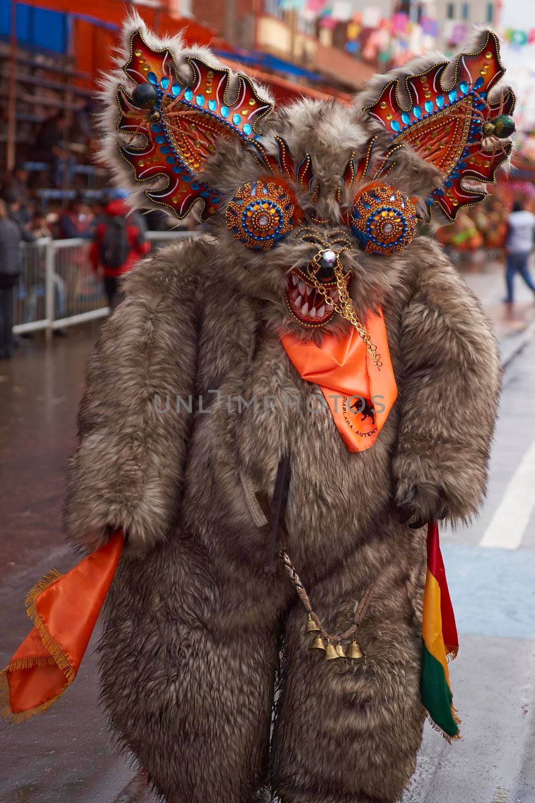 ORURO, BOLIVIA - FEBRUARY 25, 2017: Diablada dancer in ornate bear costume parading through the mining city of Oruro on the Altiplano of Bolivia during the annual carnival.