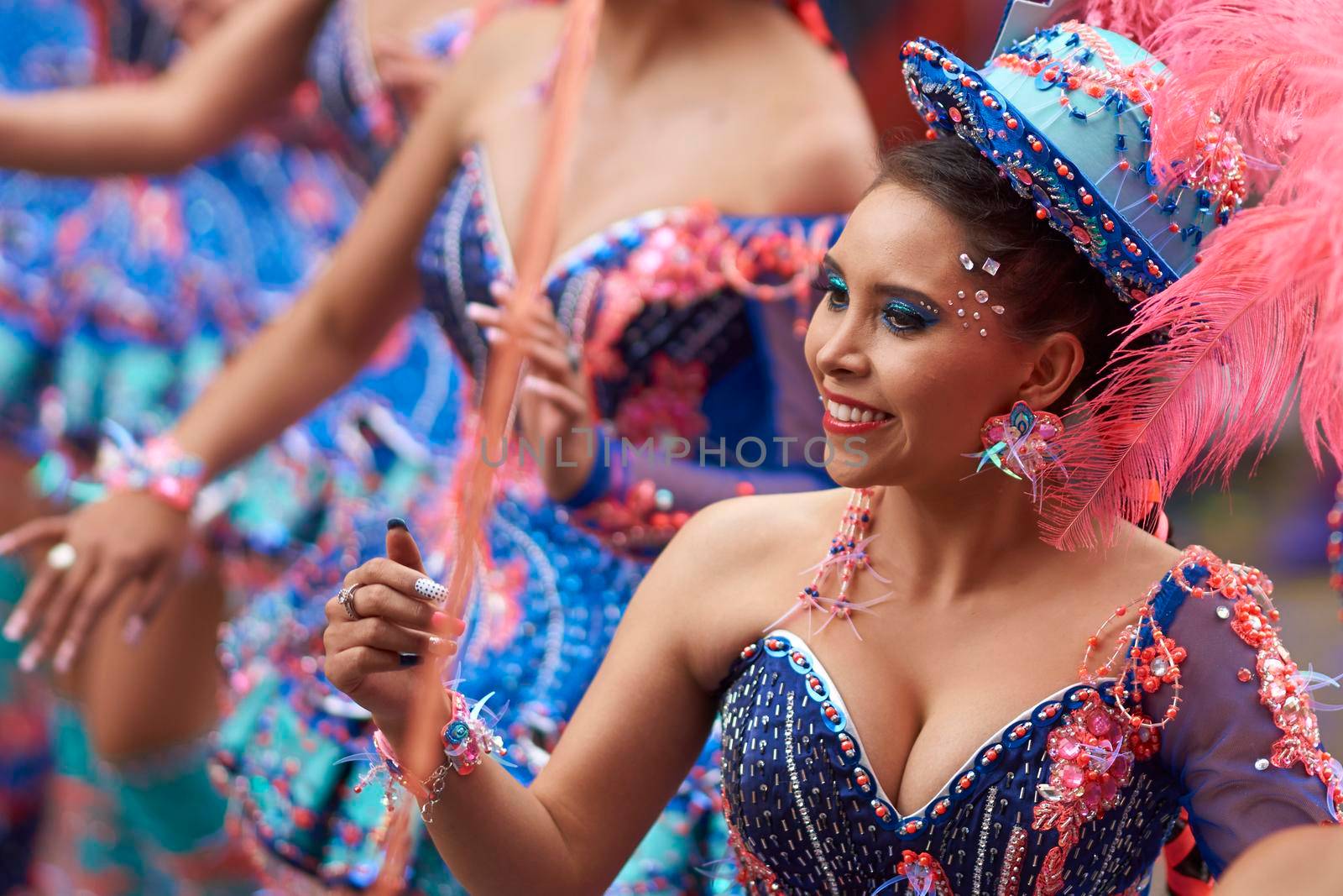 ORURO, BOLIVIA - FEBRUARY 25, 2017: Female Morenada dancers in colourful costumes parading through the mining city of Oruro on the Altiplano of Bolivia during the annual Oruro Carnival.