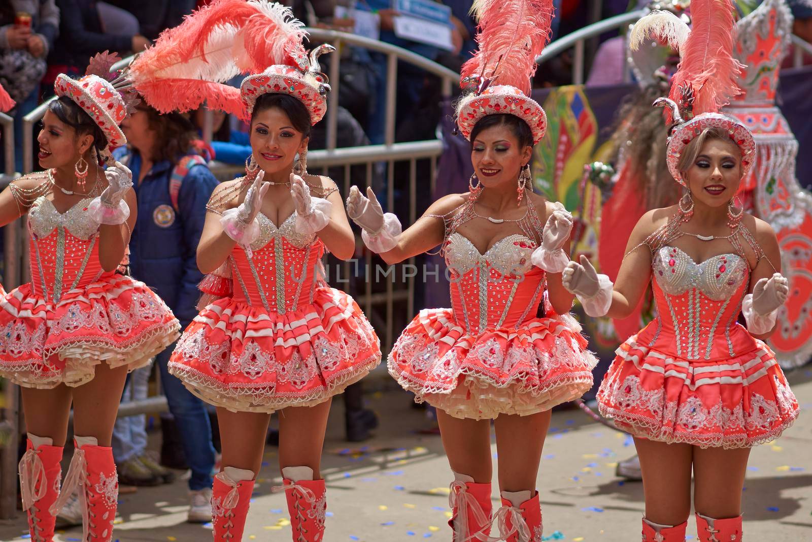 ORURO, BOLIVIA - FEBRUARY 25, 2017: Female Morenada dancers in colourful costumes parading through the mining city of Oruro on the Altiplano of Bolivia during the annual Oruro Carnival.