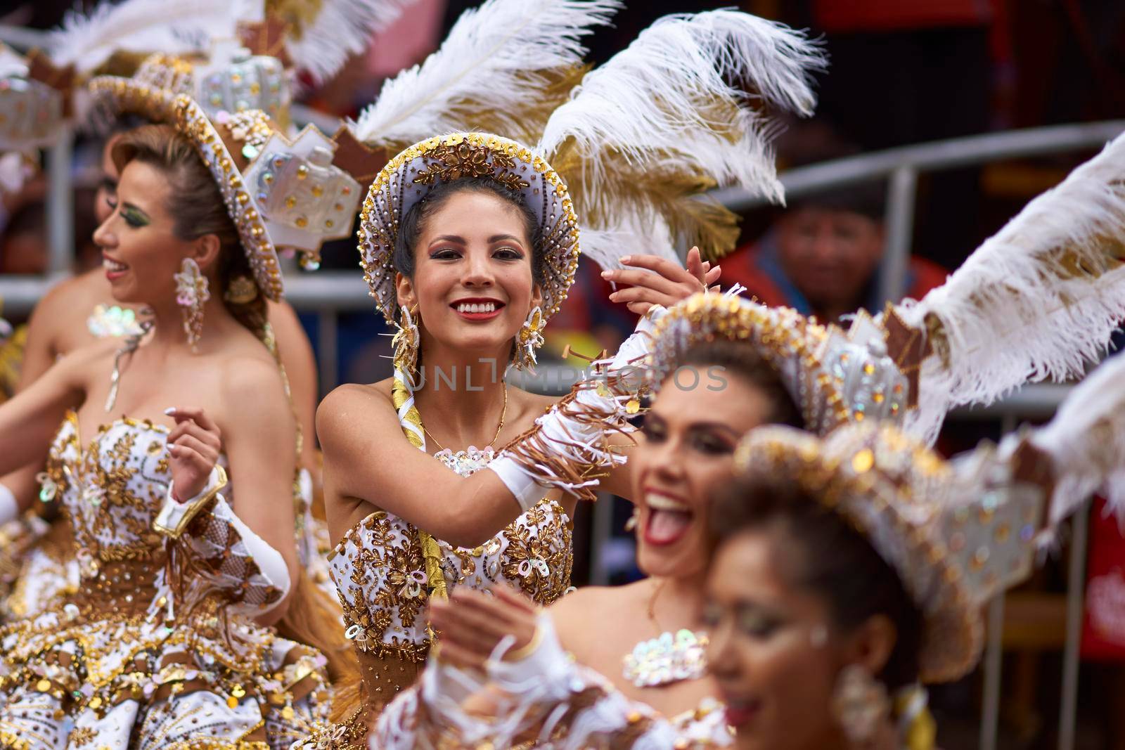 ORURO, BOLIVIA - FEBRUARY 25, 2017: Female Morenada dancers in colourful costumes parading through the mining city of Oruro on the Altiplano of Bolivia during the annual Oruro Carnival.