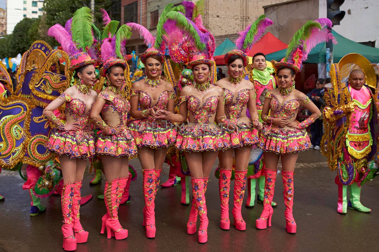 ORURO, BOLIVIA - FEBRUARY 25, 2017: Female Morenada dancers in colourful costumes parading through the mining city of Oruro on the Altiplano of Bolivia during the annual Oruro Carnival.