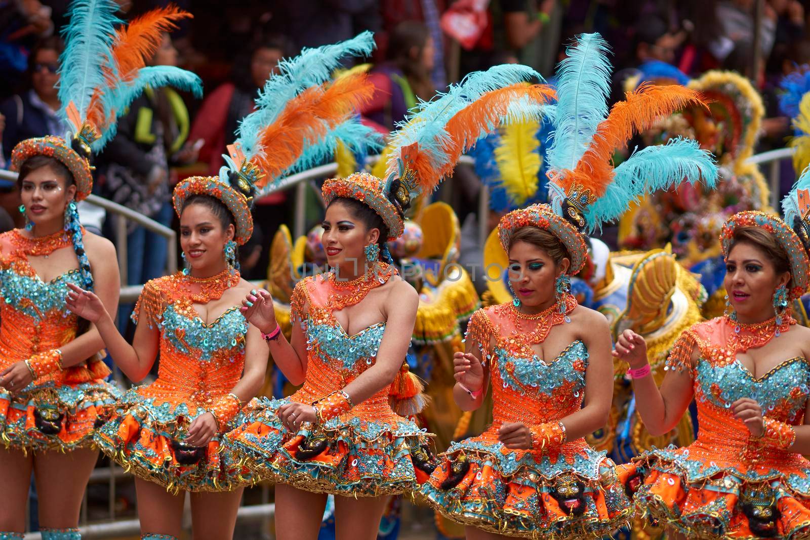 ORURO, BOLIVIA - FEBRUARY 25, 2017: Female Morenada dancers in colourful costumes parading through the mining city of Oruro on the Altiplano of Bolivia during the annual Oruro Carnival.