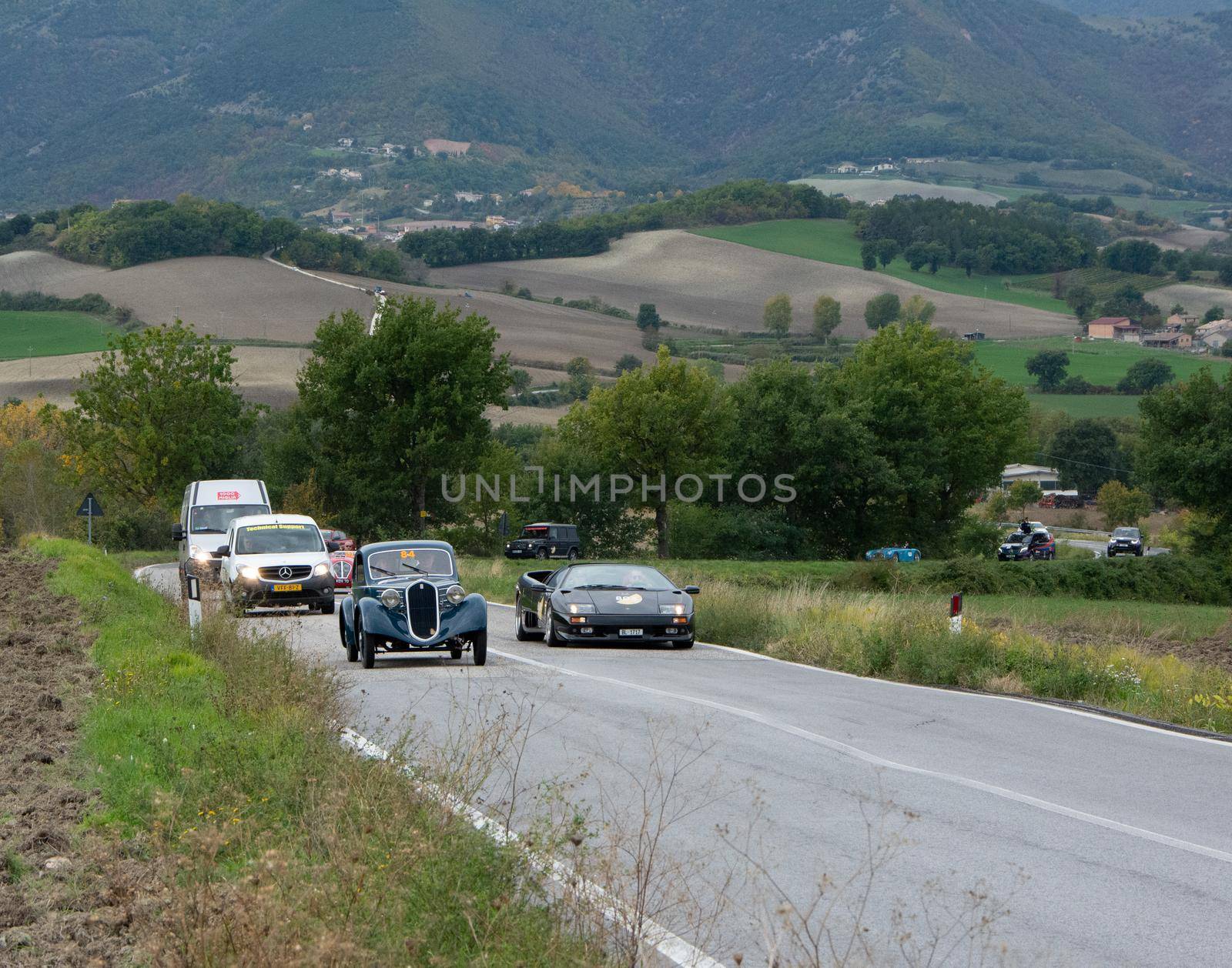 CAGLI , ITALY - OTT 24 - 2020 : FIAT 508 CS BERLINETTA AM LAMBORGHINI DIABLO on an old racing car in rally Mille Miglia 2020 the famous italian historical race (1927-1957)