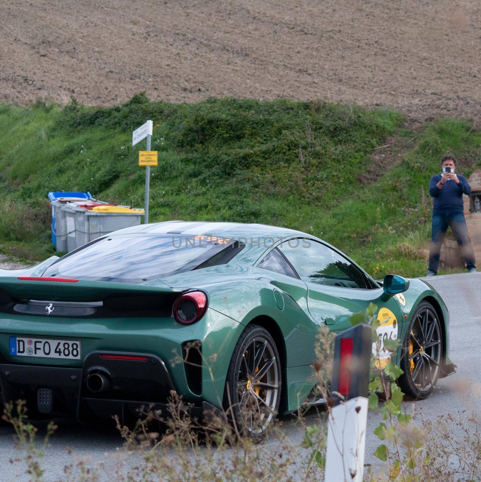 CAGLI , ITALY - OTT 24 - 2020 : FERRARI 488 PISTA on an old racing car in rally Mille Miglia 2020 the famous italian historical race (1927-1957)