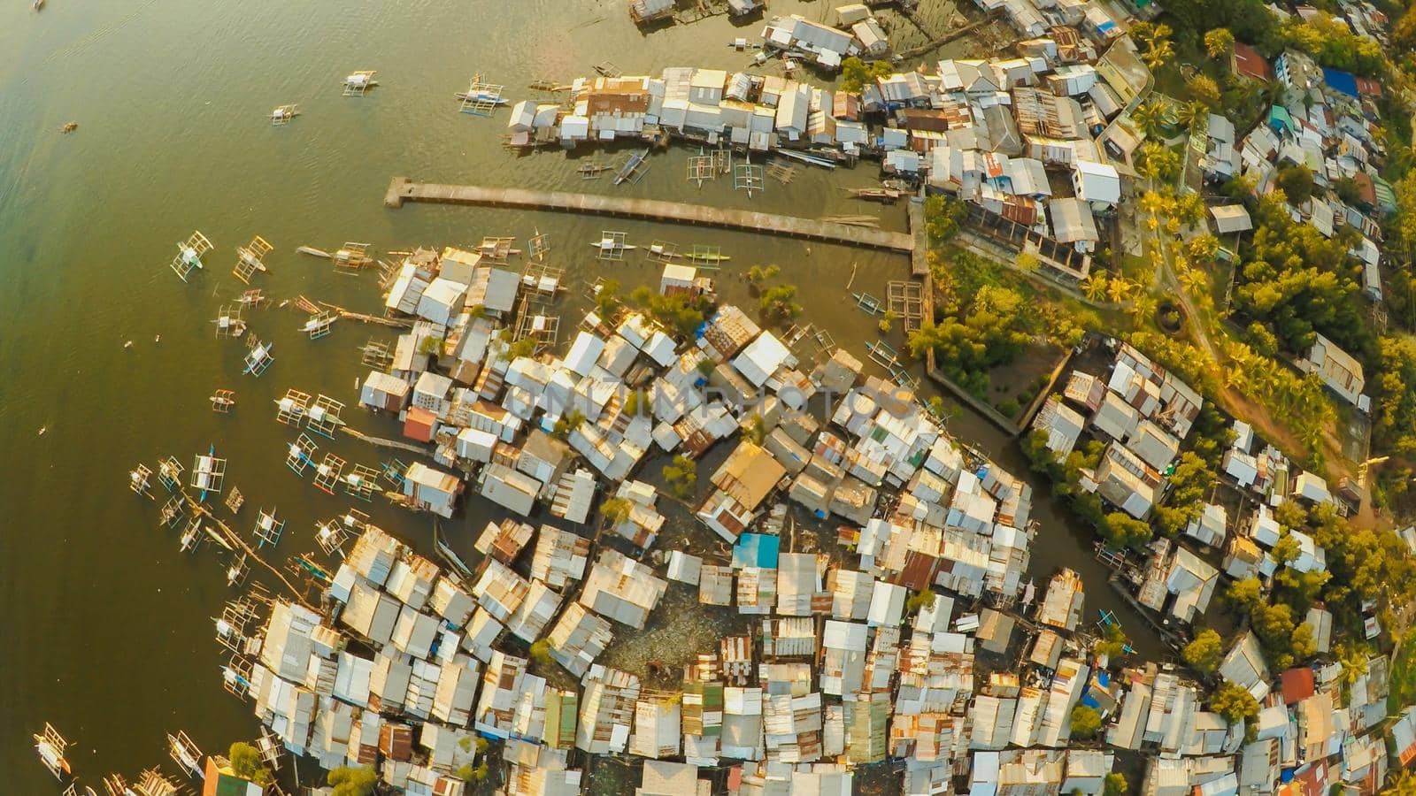 Aerial view Coron city with slums and poor district. Palawan. Bu by DovidPro