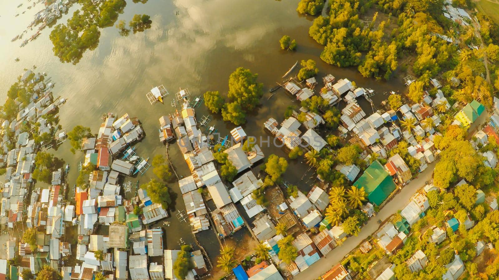 Aerial view Coron city with slums and poor district. Palawan. Busuanga island. Evening time and sunset