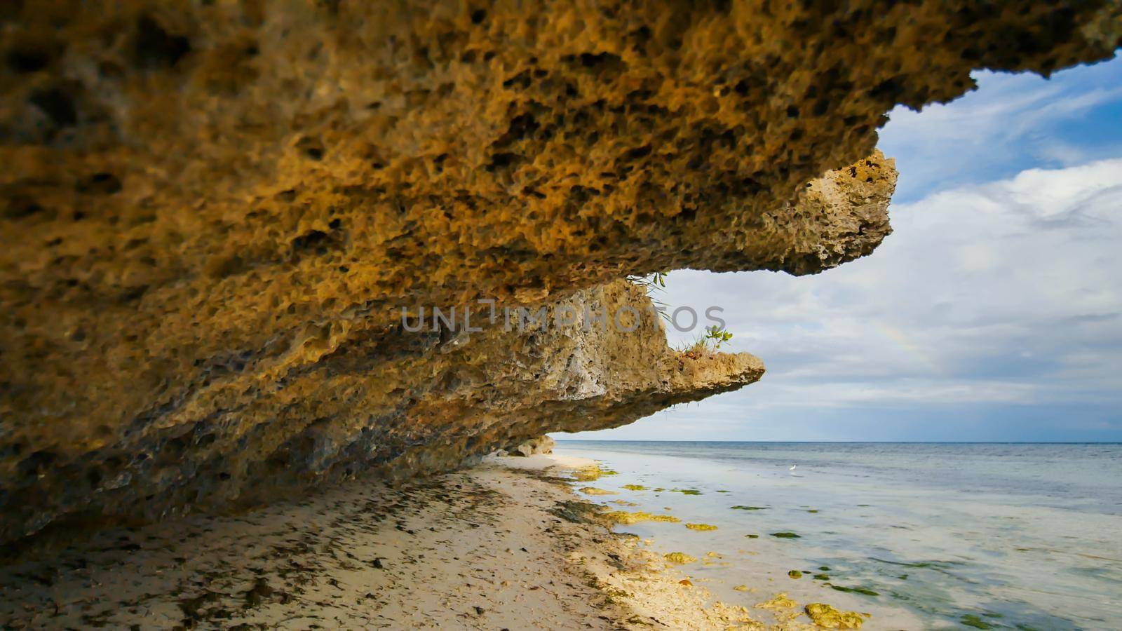 Beautiful wild tropical beach near Anda with granite rocks. Bohol Island. Philippines