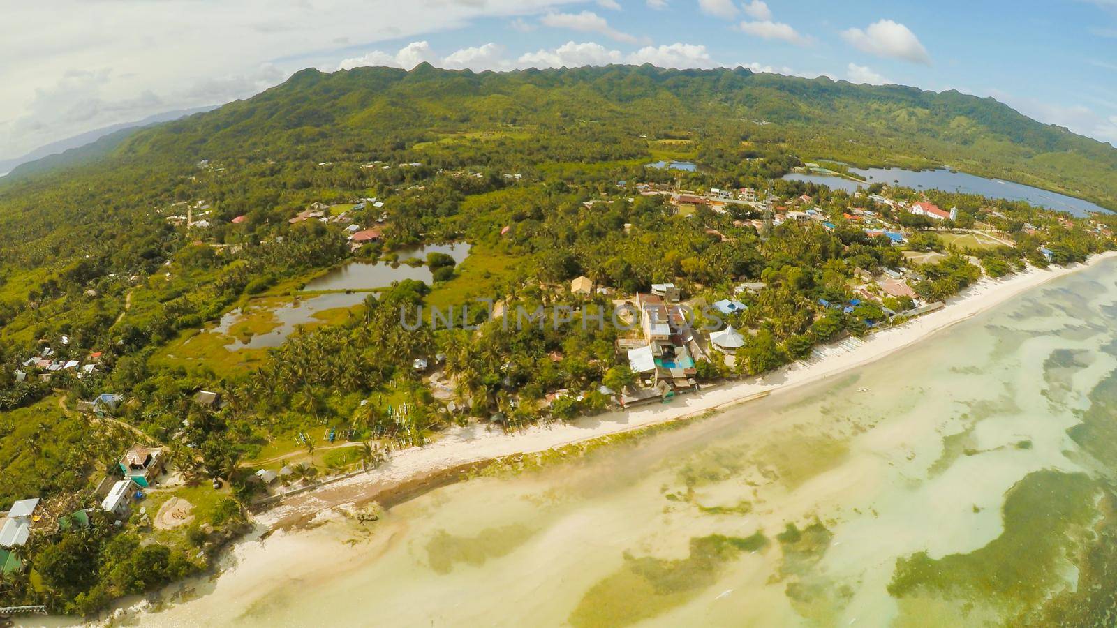 Philippine Village. Aerial view. The island of Bohol. Anda city. by DovidPro