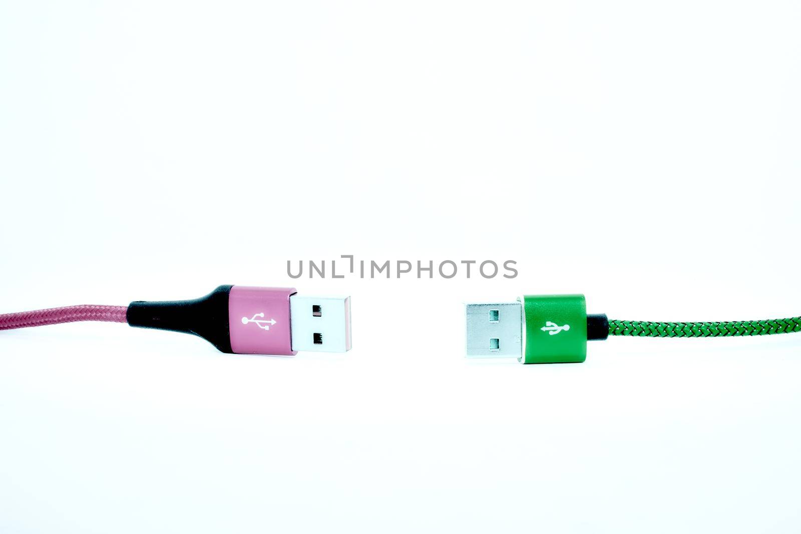 Keep distance.Two USB cable on the white background. by jovani68