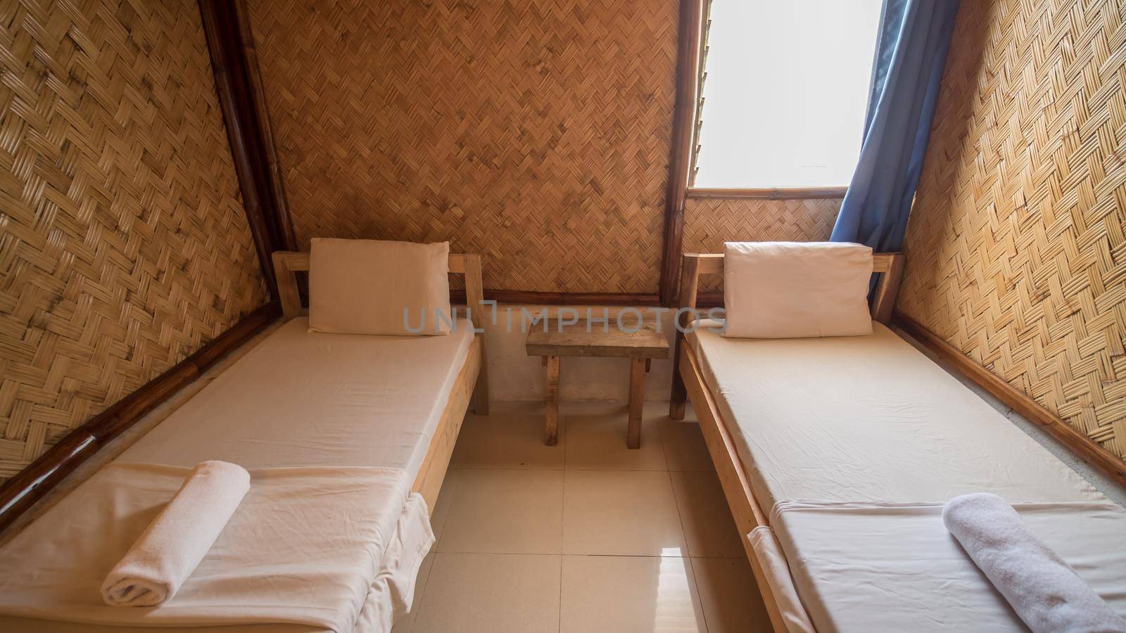 Budget Triple Hostel Room. Two beds. Asian country