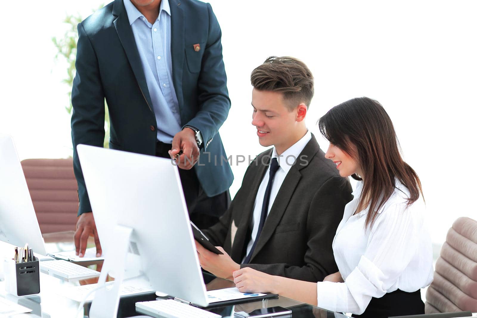 business team working with documents in a modern office. by SmartPhotoLab