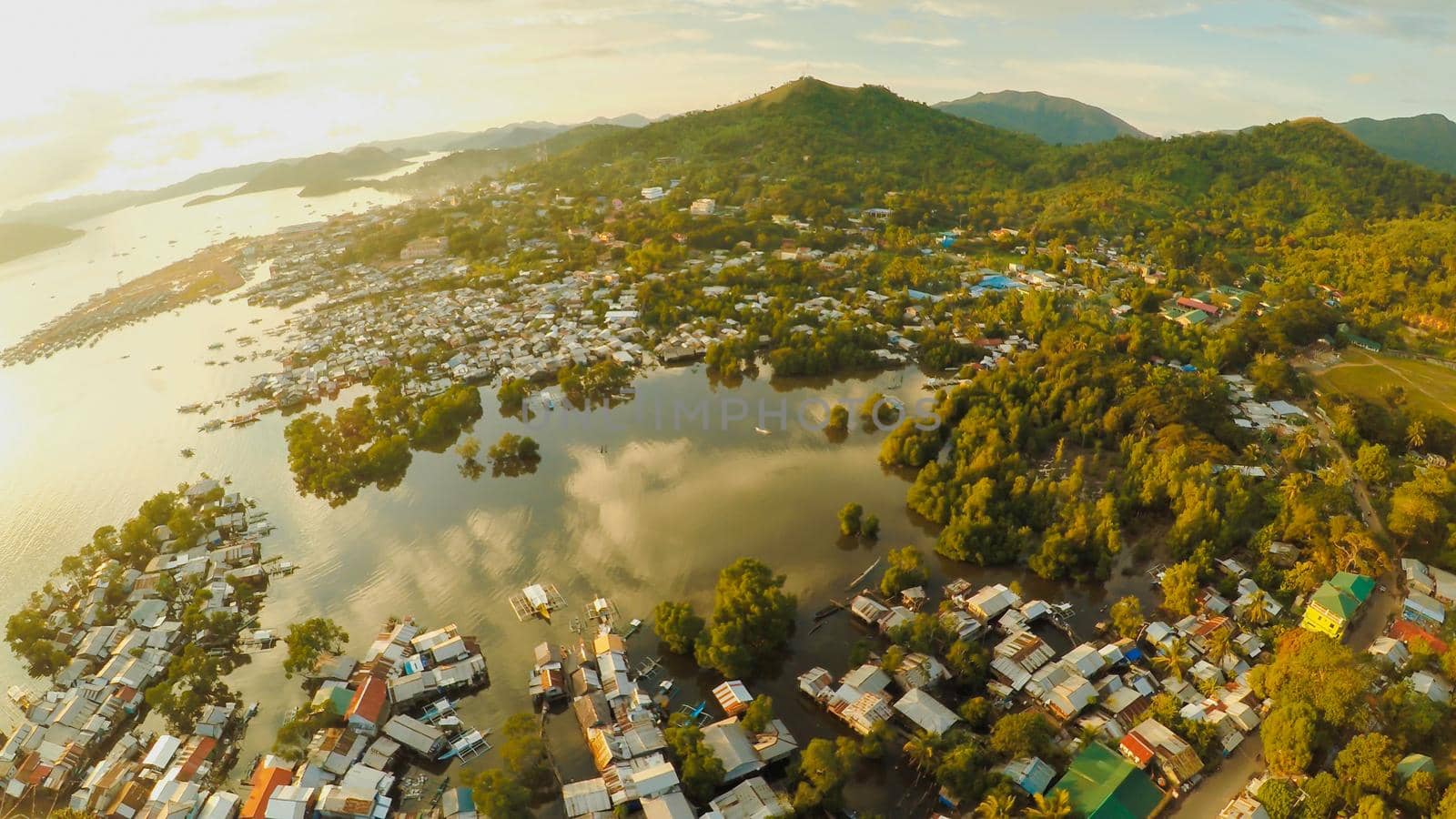 Aerial view Coron city with slums and poor district. Palawan. Bu by DovidPro