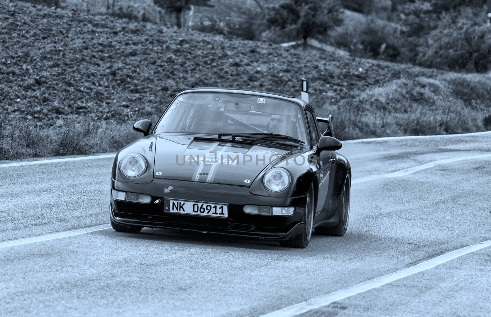 CAGLI , ITALY - OTT 24 - 2020 : PRSCHE CARRERA LIVREA MARTINI on an old racing car in rally Mille Miglia 2020 the famous italian historical race (1927-1957)