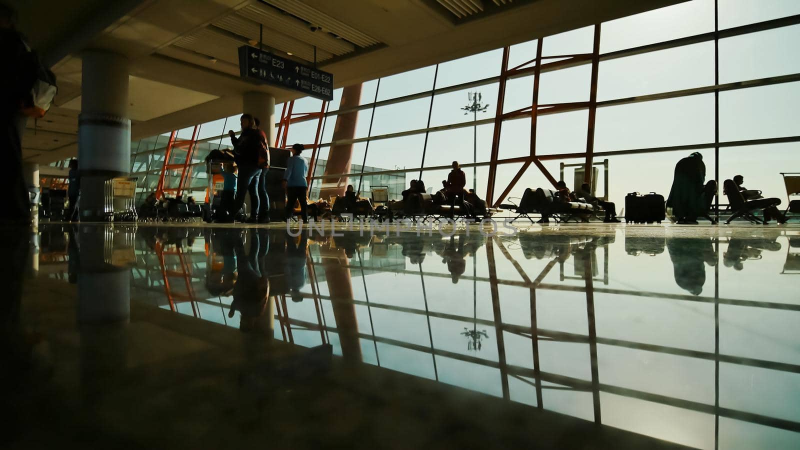 People at a modern airport, departure lounge. by DovidPro