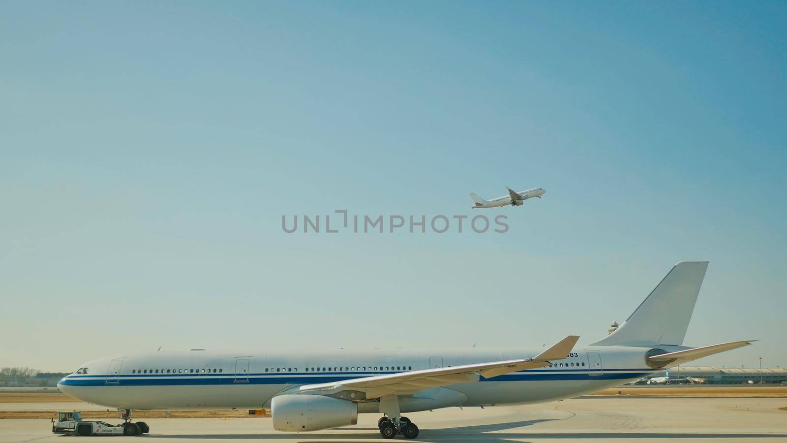 Passenger plane fly up over take-off runway from airport. by DovidPro