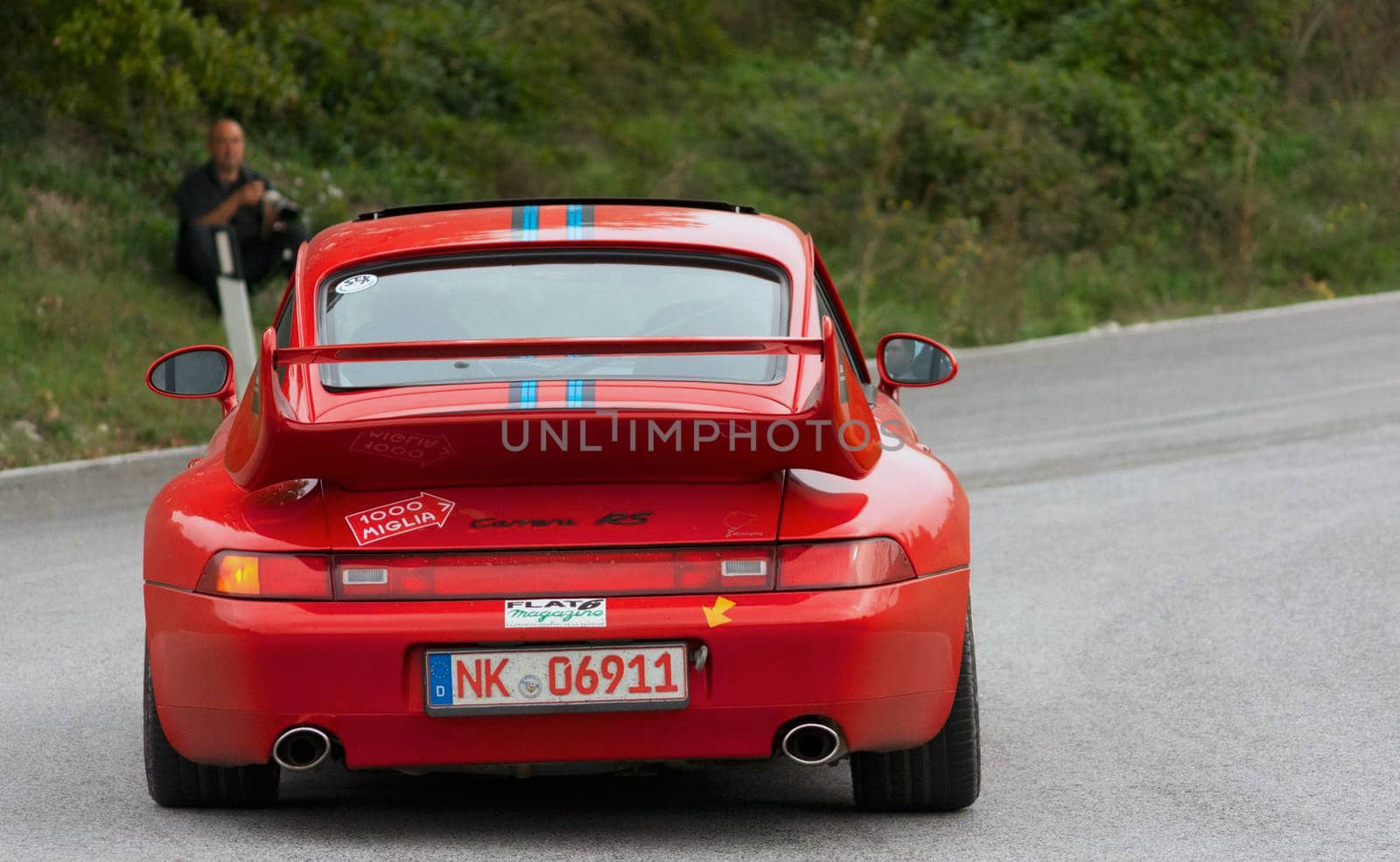 CAGLI , ITALY - OTT 24 - 2020 : PRSCHE CARRERA LIVREA MARTINI on an old racing car in rally Mille Miglia 2020 the famous italian historical race (1927-1957)