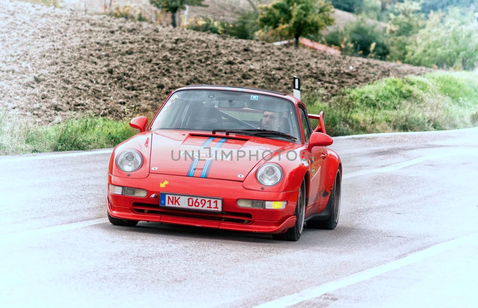 CAGLI , ITALY - OTT 24 - 2020 : PRSCHE CARRERA LIVREA MARTINI on an old racing car in rally Mille Miglia 2020 the famous italian historical race (1927-1957)