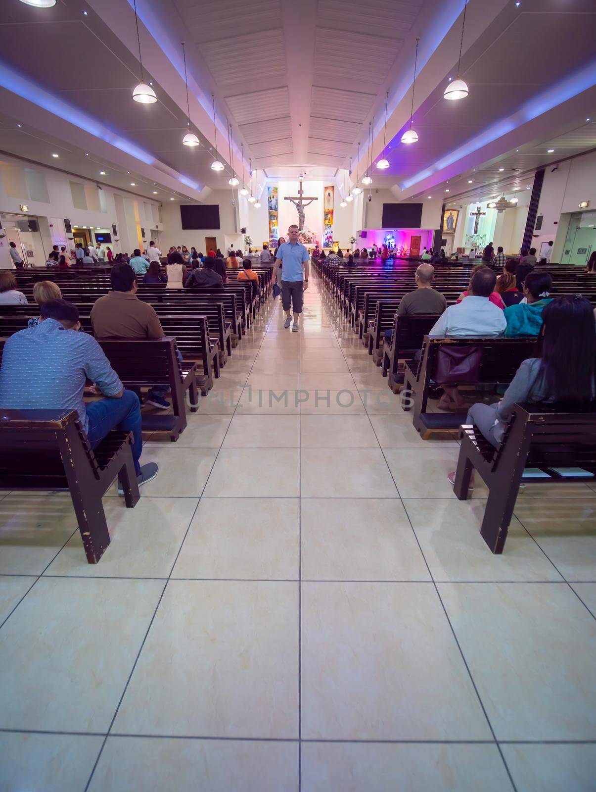 Dubai, UAE - May 15, 2018:: Catholic church during the service with people.. Christianity in Muslim countries. by DovidPro