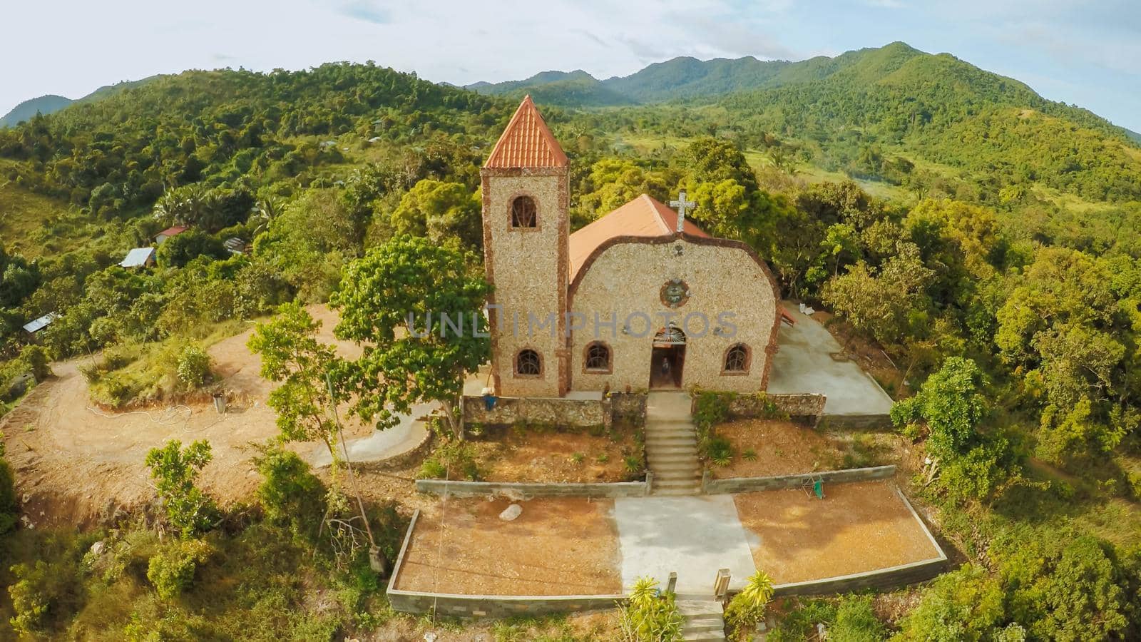 Church on a hill in Malbato village. Philippines. Coron. Palawan. Aerial view. by DovidPro