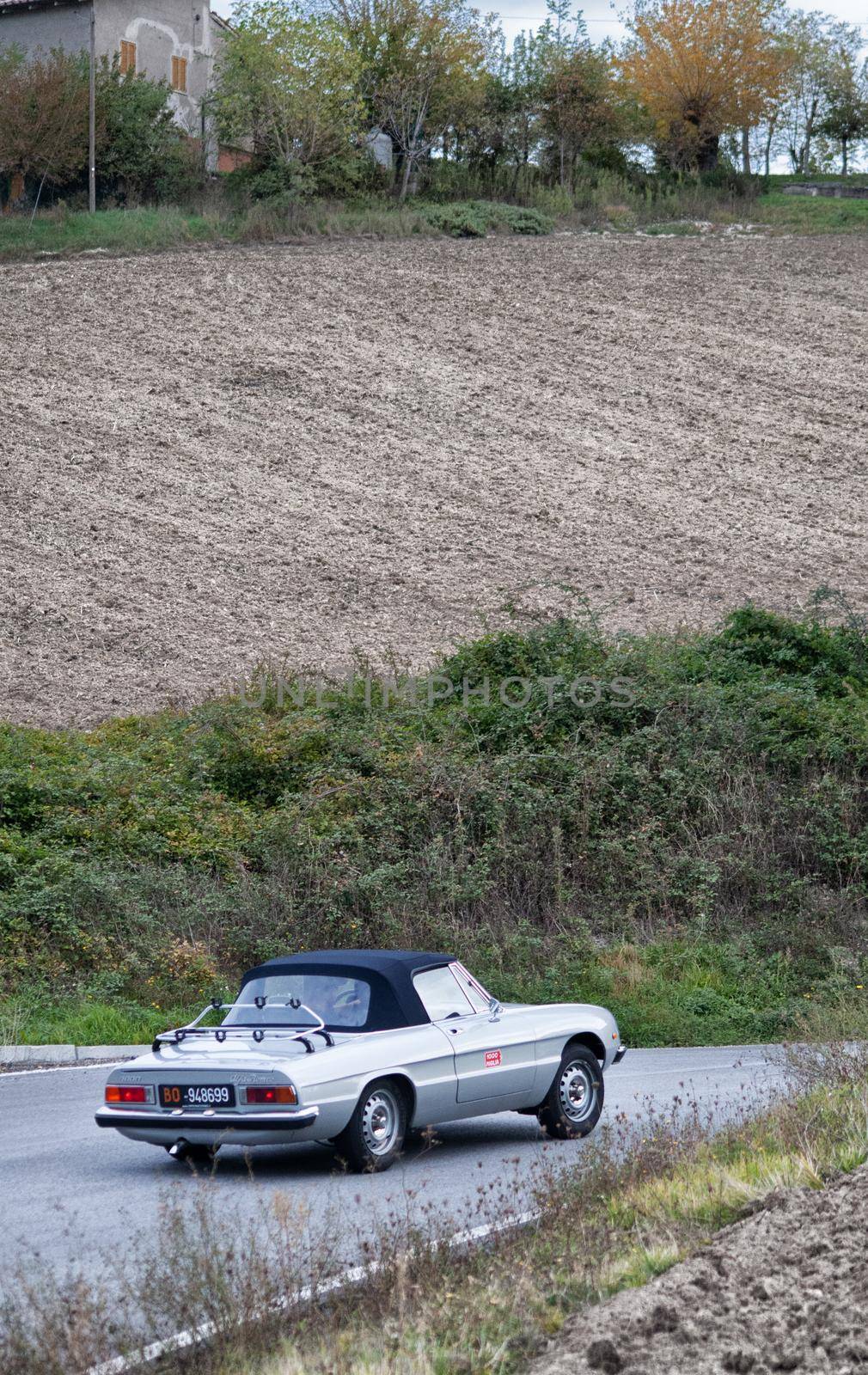 CAGLI , ITALY - OTT 24 - 2020 : ALFA ROMEO SPIDER CODA TRONCA on an old racing car in rally Mille Miglia