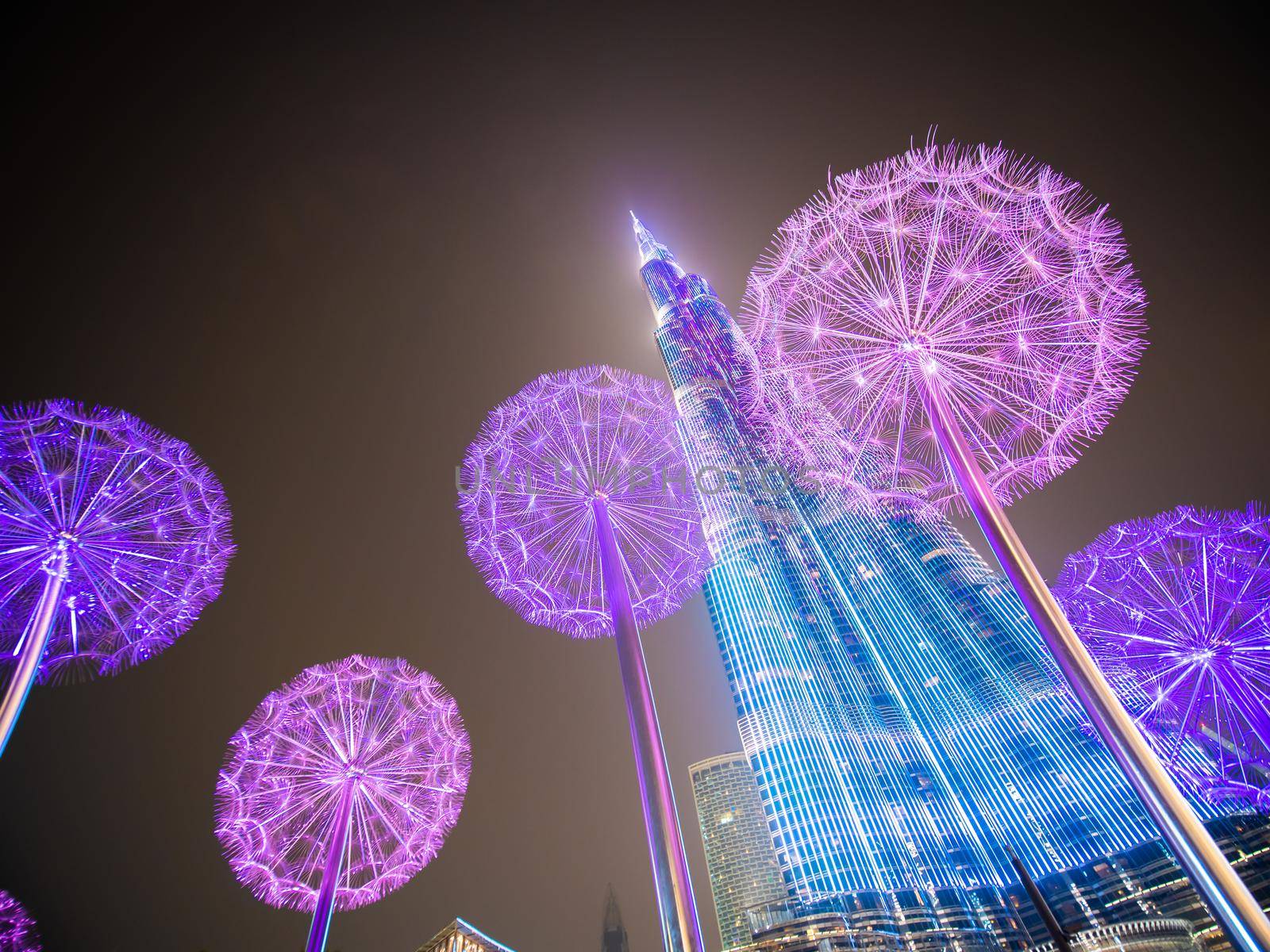 Dubai, UAE - May 15, 2018: Burj Khalifa in the late evening against the background of luminous dandelions. by DovidPro
