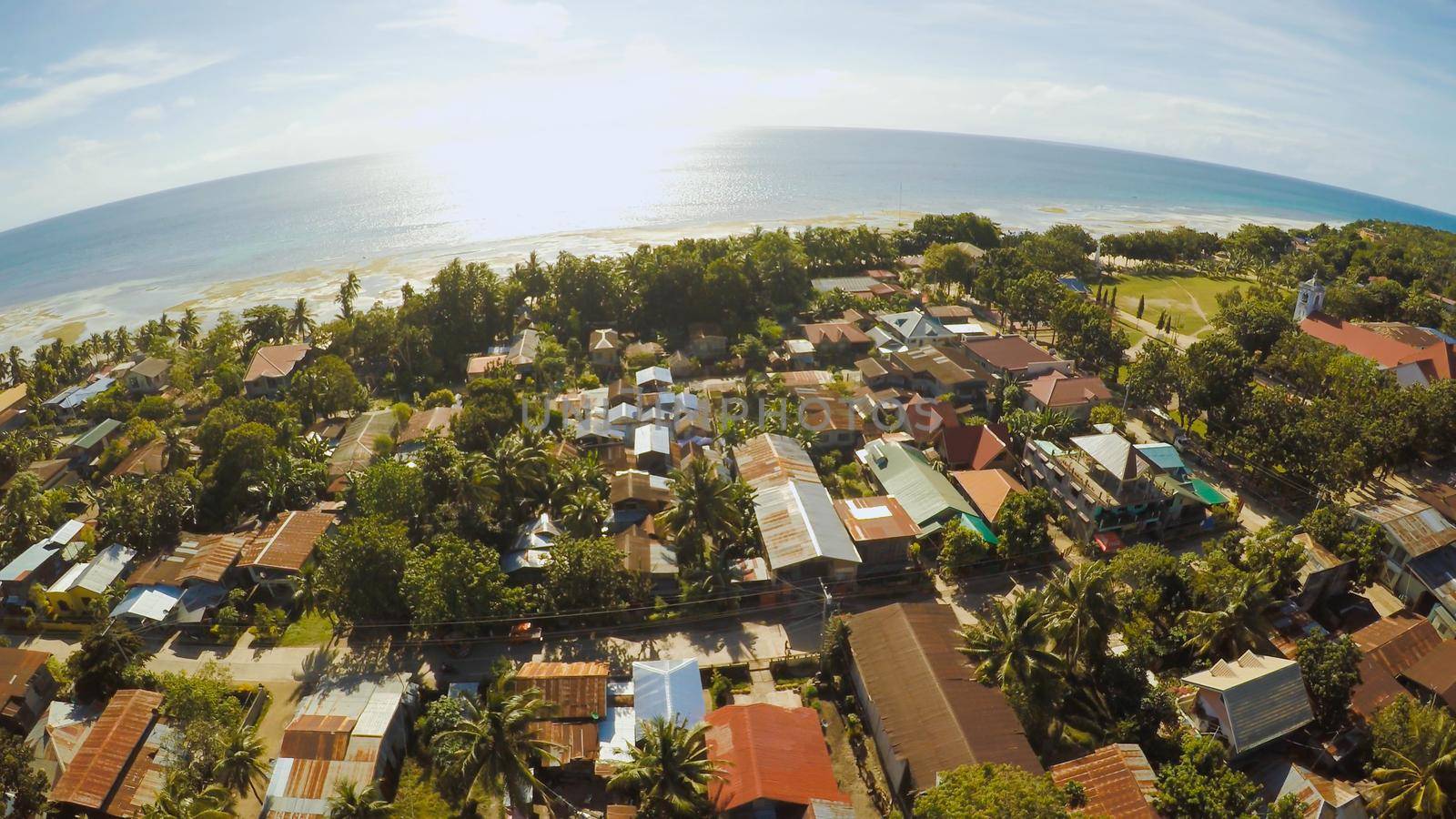 Philippine Village. Aerial view. The island of Bohol. Anda city. by DovidPro