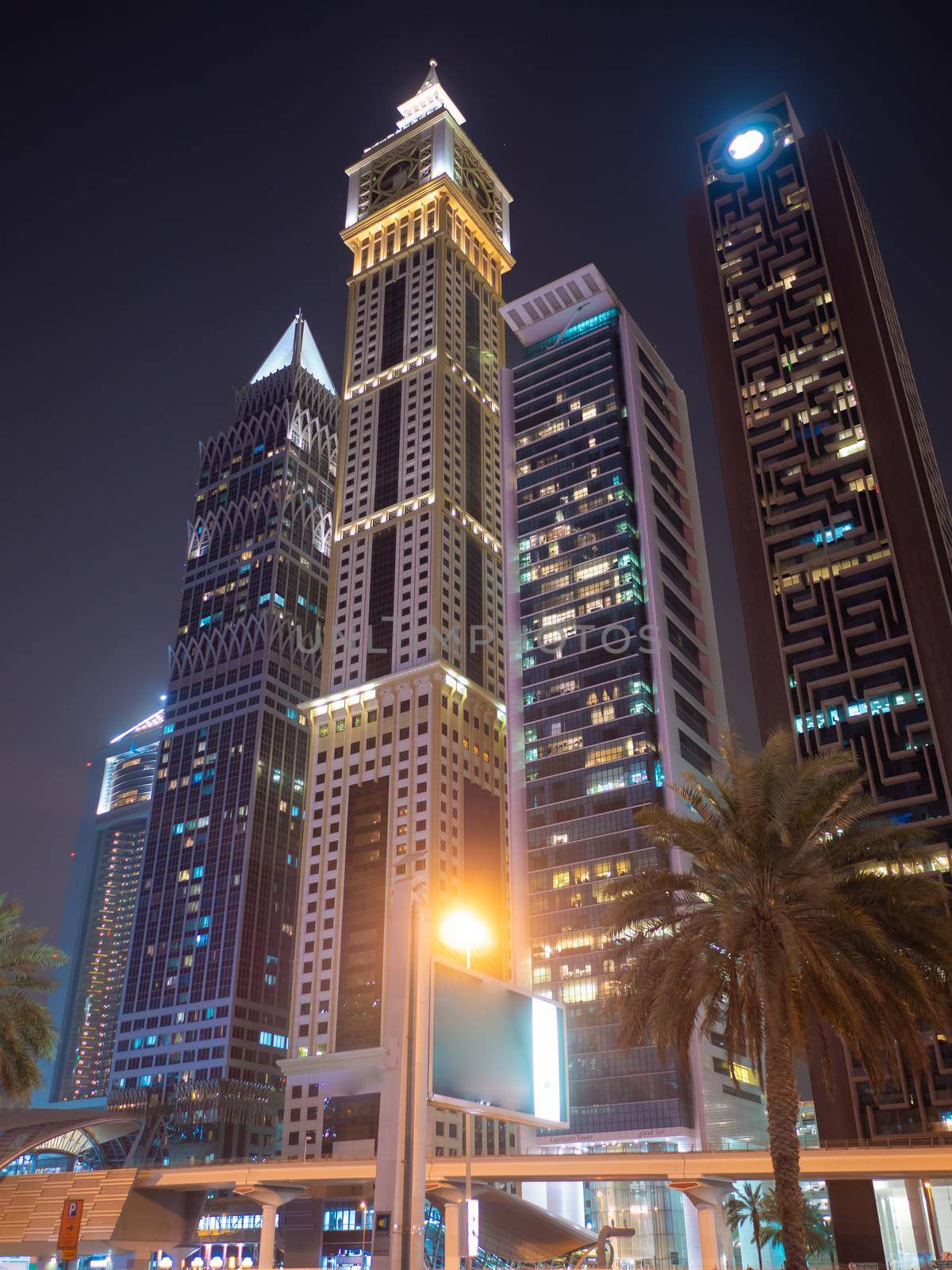 Night view of Dubai Downtown with skyscrapers. by DovidPro