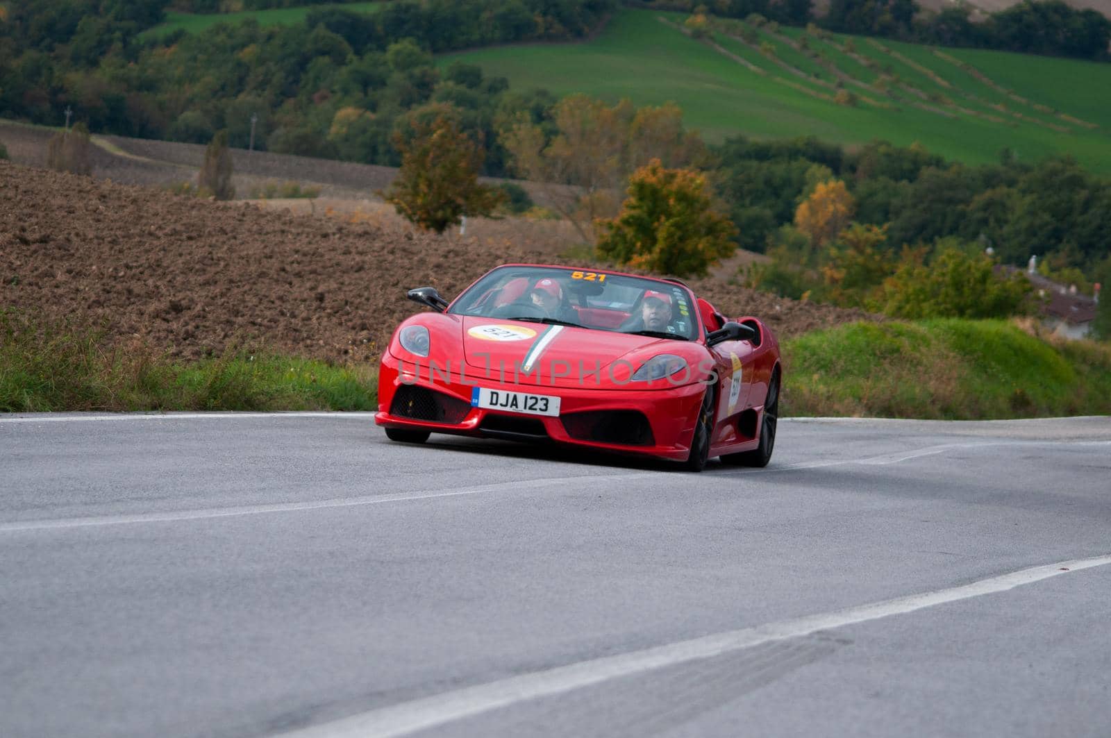 CAGLI , ITALY - OTT 24 - 2020 : FERRARI SCUDERIA SPIDER 16M on an old racing car in rally Mille Miglia 2020 the famous italian historical race (1927-1957)