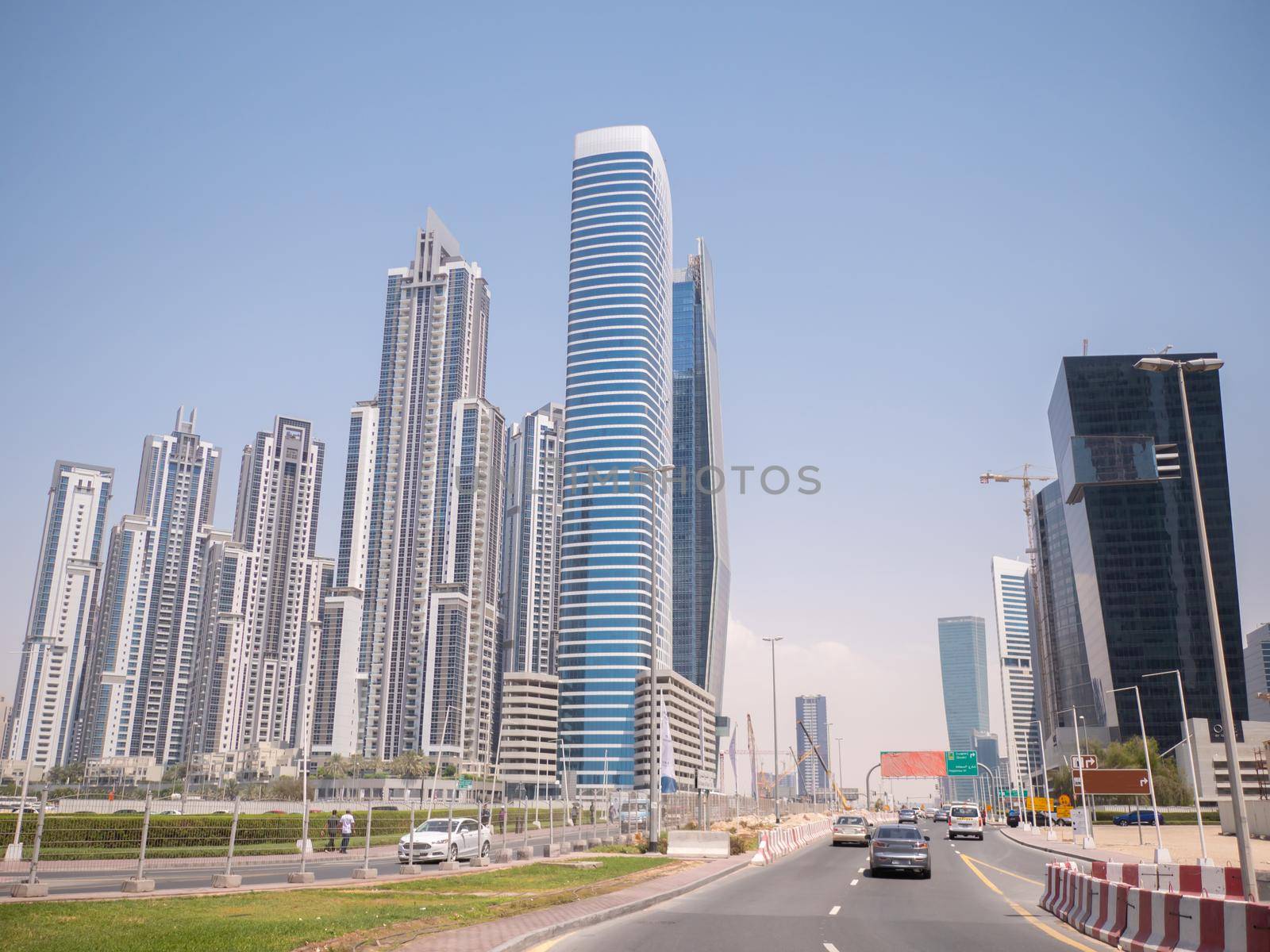 Modern buildings and street in Dubai on a clear day.