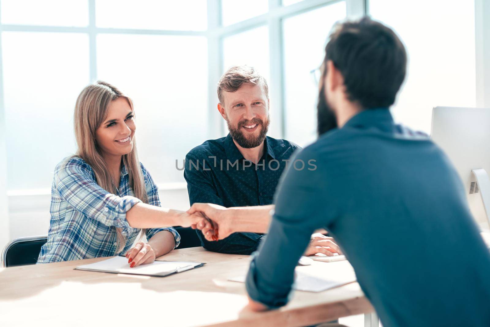 managers interview the applicant sitting at the office table. the concept of employment