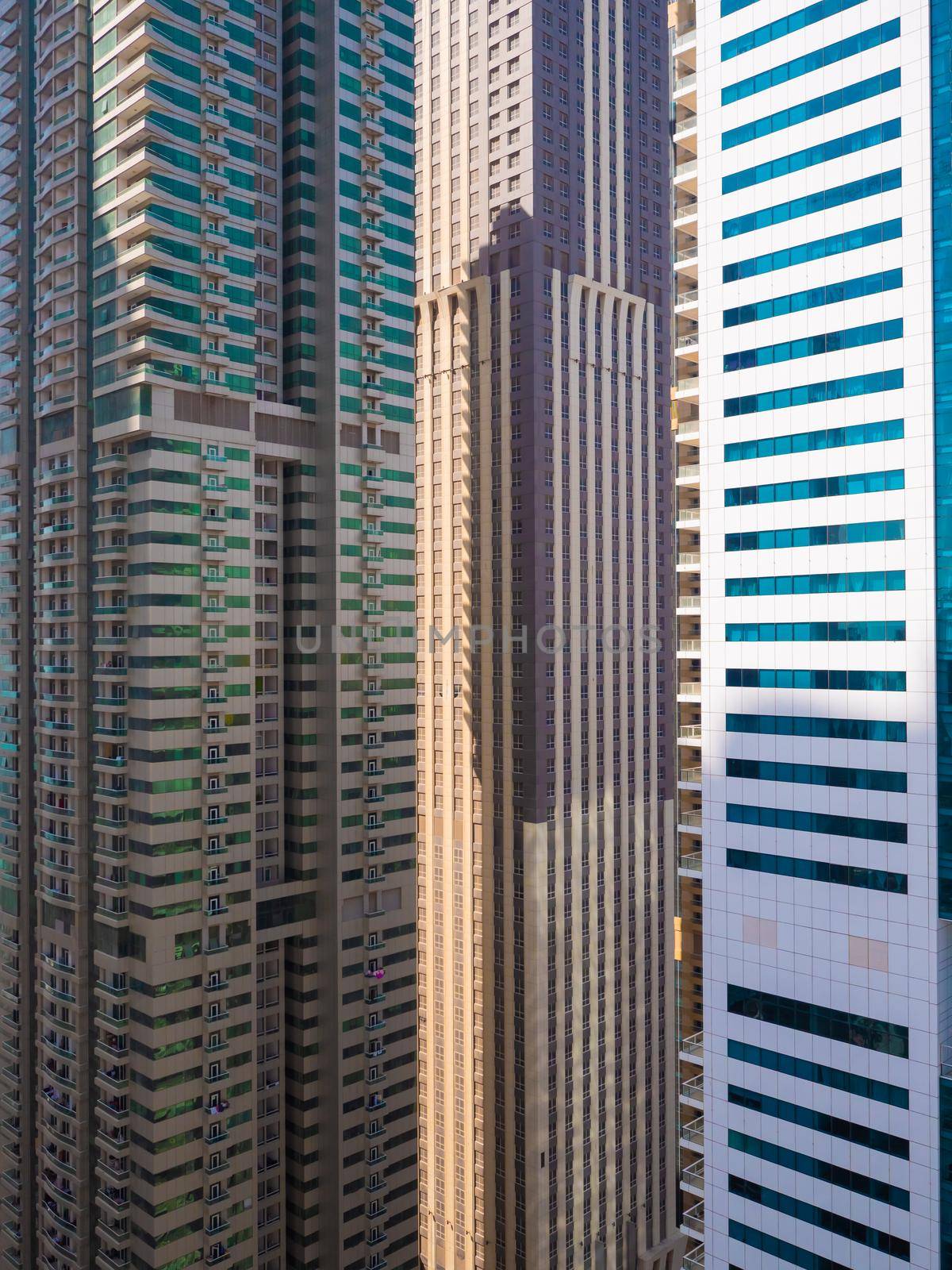 Residential skyscraper in Dubai on a sunny day. UAE. by DovidPro