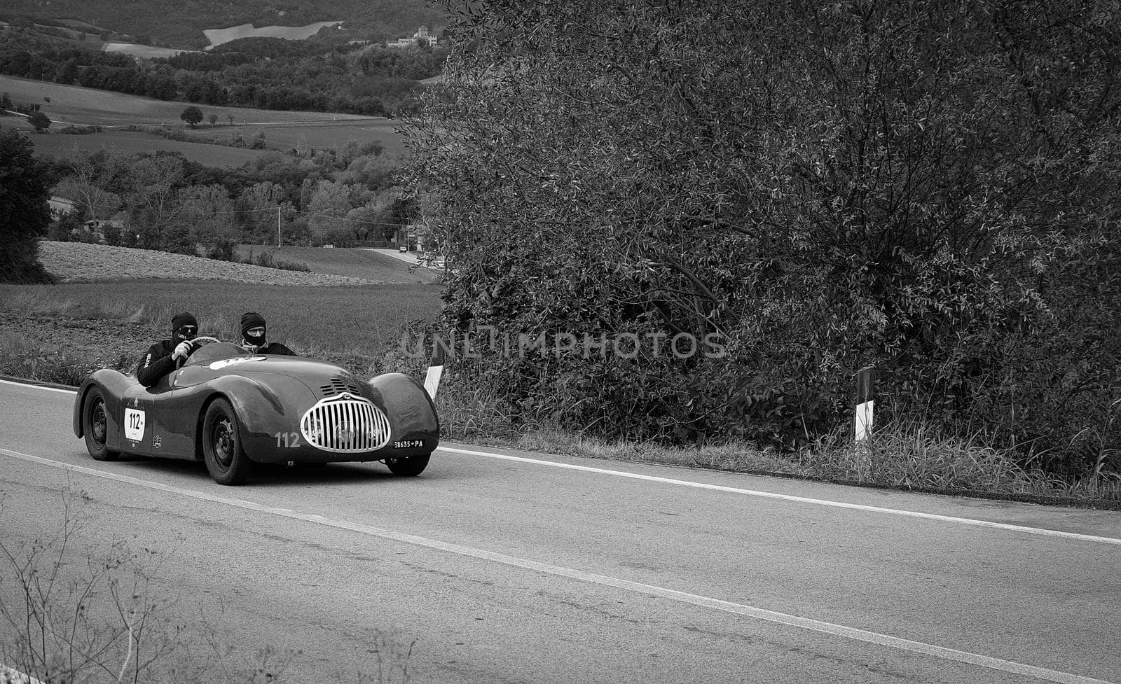 CAGLI , ITALY - OTT 24 - 2020 : FIAT-LANCIA APRILIA BARCHETTA FAINA 1939 on an old racing car in rally Mille Miglia 2020 the famous italian historical race (1927-1957