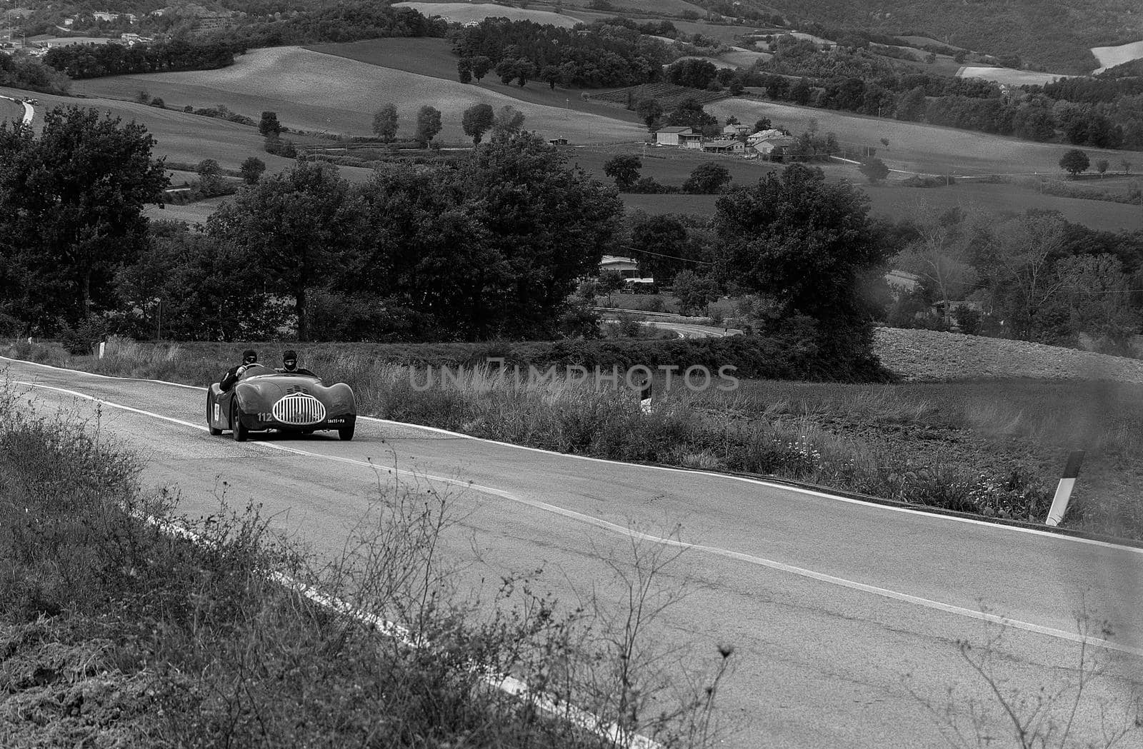 CAGLI , ITALY - OTT 24 - 2020 : FIAT-LANCIA APRILIA BARCHETTA FAINA 1939 on an old racing car in rally Mille Miglia 2020 the famous italian historical race (1927-1957