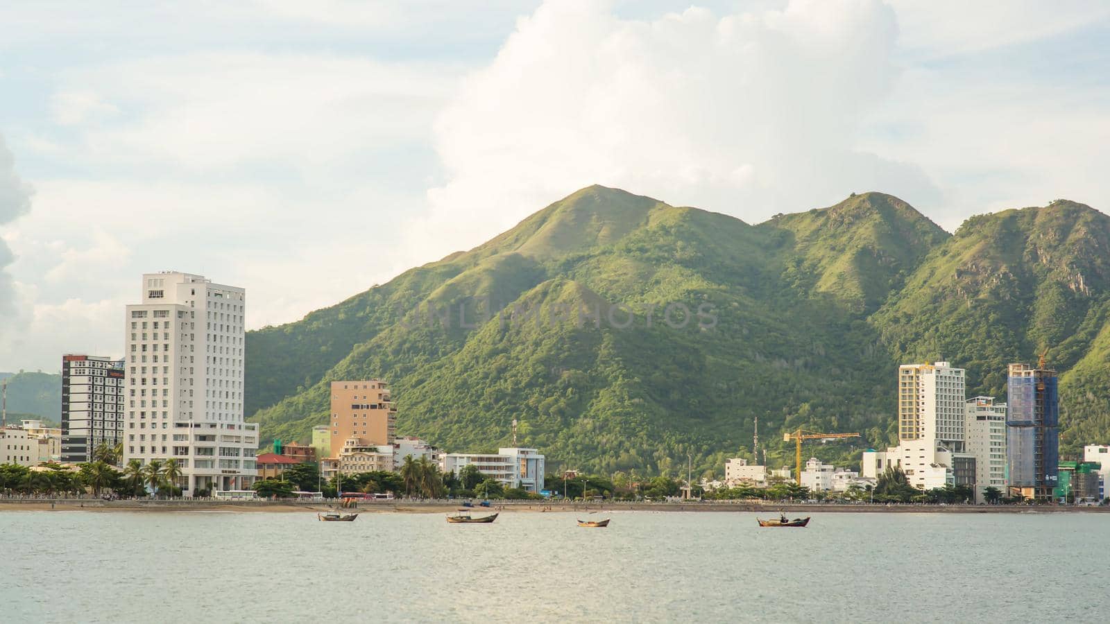 Panorama of one part of the city of Nha Trang with mountains. Vietnam.